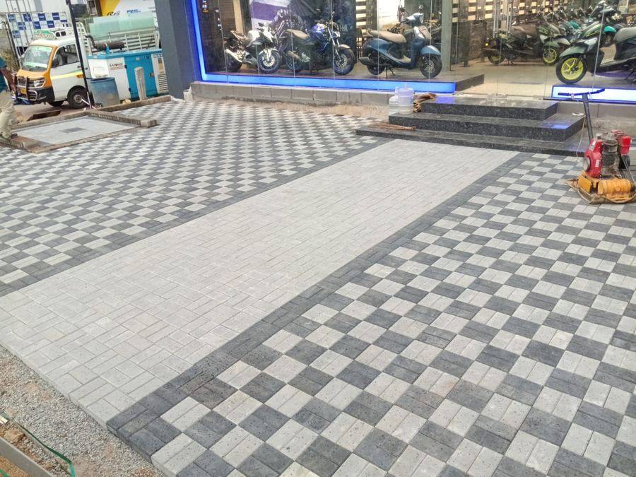 Checkered paver blocks at Yamaha showroom forecourt