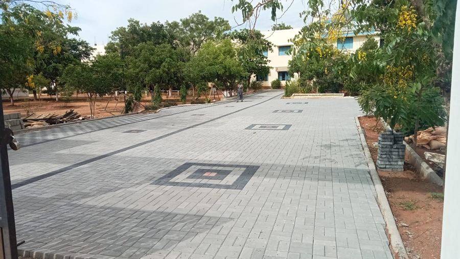 Wide decorative paver driveway at institutional campus